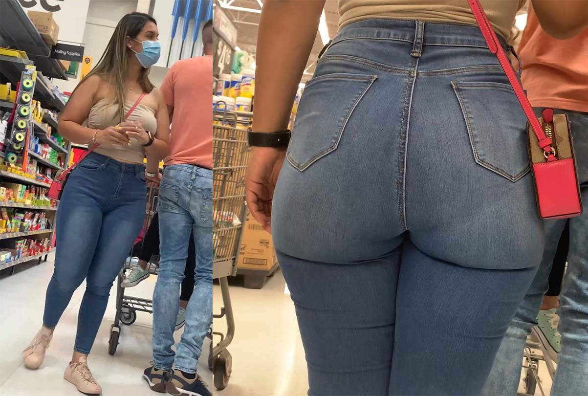 a playful glance from a girl in blue jeans